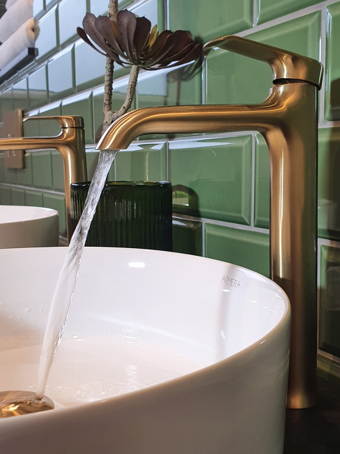 Round bowl on tempest black counter-top, Vaere extended single lever monobasin mixer and click clack waste in brushed gold.